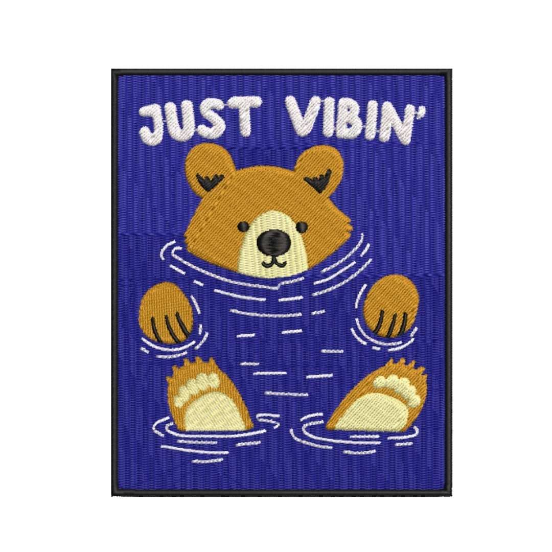 Bordado "Just vibin´" en sudadera cuello redondo.